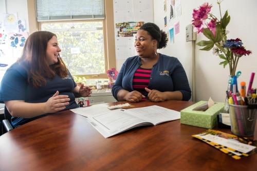 Left to right: Ashley Jess, a Forensics Graduate Student chats with career advisor Marjannie Akintunde, in her office in South Hall. Akintunde earned her PhD from UC Davis and now works as a career advisor for master's, Ph.D. and postdoctoral scholars.