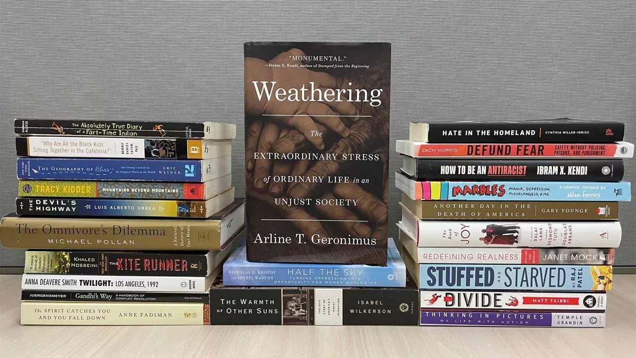 Weathering book cover showing in center, framed on either side by stacks of other books