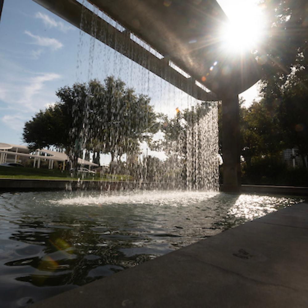 Sunlight shine through the water of the fountain in the Vanderhoef Quad on September 17, 2024.
